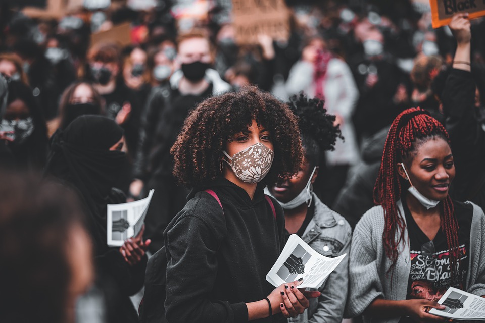 Image of a protest attended by various women of color.